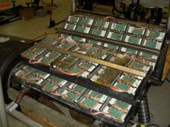 greent155 - Battery packs. Lithium Ion cells from DeWalt 36 volt drill packs, removed from packs and put into custom housings.  The circuit boards were designed by Michael Kadie for balancing the cells.  Output of 290 volts DC and peak of 1000 amps.