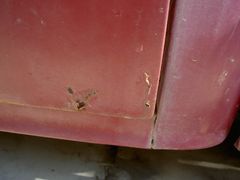 Driver side rear lower door rust