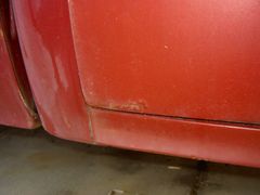 Pass. side rear lower door rust